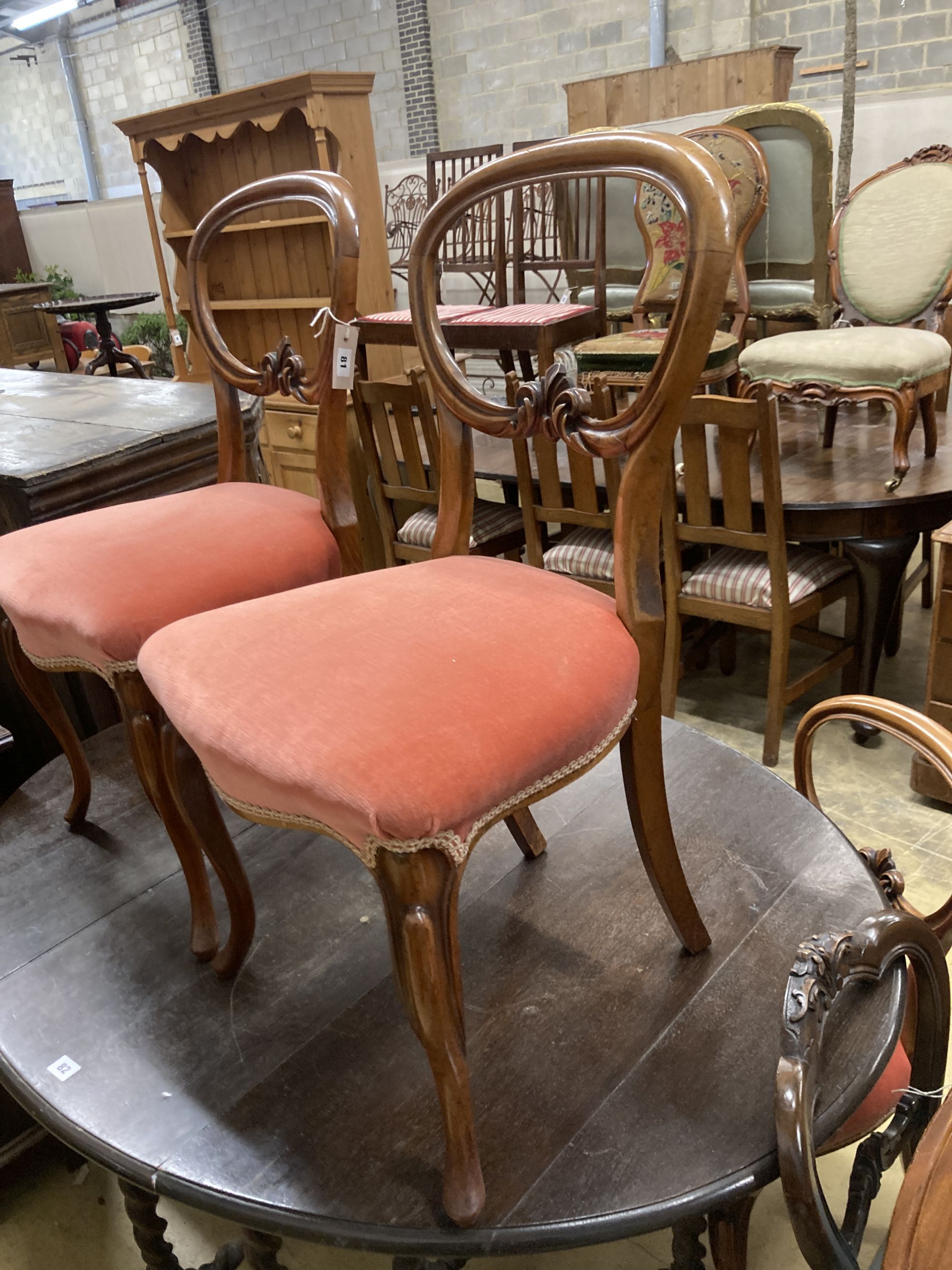 A set of four Victorian mahogany balloon back dining chairs